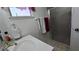 Close-up of bathroom vanity with a sink, mirror, towel rack and glass shower at 5209 Del Monte Ave, Las Vegas, NV 89146