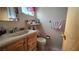 A bathroom featuring a vanity with sink, toilet, and a medicine cabinet above the sink at 5209 Del Monte Ave, Las Vegas, NV 89146