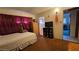 Bedroom with red curtains, a bed and access to the bathroom and another room at 5209 Del Monte Ave, Las Vegas, NV 89146