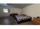 Spacious room with a ceiling fan, large bed and side dresser at 5209 Del Monte Ave, Las Vegas, NV 89146