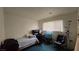 Cozy bedroom featuring a single bed, window, and carpeted floor at 5209 Del Monte Ave, Las Vegas, NV 89146