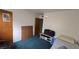 Modest bedroom with a twin bed and a door leading to another room at 5209 Del Monte Ave, Las Vegas, NV 89146