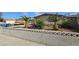 Exterior of a single story home showcasing desert landscaping, privacy wall and boat on the driveway at 5209 Del Monte Ave, Las Vegas, NV 89146
