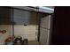 Garage interior with overhead doors, a refrigerator, and various supplies at 5209 Del Monte Ave, Las Vegas, NV 89146