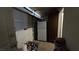 Garage interior with garage doors, a refrigerator, and storage at 5209 Del Monte Ave, Las Vegas, NV 89146