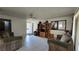 Light-filled living room features tile flooring, cozy sofas, and plenty of space for entertaining at 5209 Del Monte Ave, Las Vegas, NV 89146