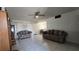 Inviting living room with tile flooring, comfortable seating, and a bright, airy feel at 5209 Del Monte Ave, Las Vegas, NV 89146
