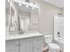Bright bathroom featuring a tub and shower combo, vanity with sink and a well lit mirror at 5912 Kentlands St, Las Vegas, NV 89130
