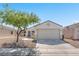 A front-facing home showcases desert landscaping, and an attached two-car garage at 5912 Kentlands St, Las Vegas, NV 89130