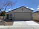 Charming single-story home with a well-maintained front yard and a two-car garage at 5912 Kentlands St, Las Vegas, NV 89130