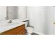 Bathroom features single sink, wooden cabinet, toilet, and medicine cabinet at 6112 Grape Blossom Ave, Las Vegas, NV 89142