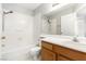 Full bath features tub and shower combo, and vanity with a single sink at 6112 Grape Blossom Ave, Las Vegas, NV 89142