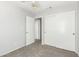Bedroom with standard closet, carpeted floor, and ceiling fan at 6112 Grape Blossom Ave, Las Vegas, NV 89142