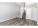 Bright foyer area showcasing hardwood floors, a staircase, and neutral paint for a welcoming ambiance at 6112 Grape Blossom Ave, Las Vegas, NV 89142