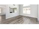 Spacious living room showcasing hardwood floors, neutral paint, and large windows providing ample natural light at 6112 Grape Blossom Ave, Las Vegas, NV 89142