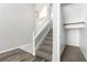 Carpeted staircase leads upstairs to a landing, complemented by a closet for practical storage solutions at 6112 Grape Blossom Ave, Las Vegas, NV 89142