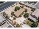 Aerial view of a single story home in a sandy lot with trees surrounded by block wall at 6337 W Cactus Ave, Las Vegas, NV 89141