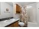 Bathroom with tub and shower, granite countertop vanity, and cabinet space at 6337 W Cactus Ave, Las Vegas, NV 89141