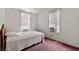 Cozy bedroom with carpeted floors and large windows for ample natural light at 6337 W Cactus Ave, Las Vegas, NV 89141