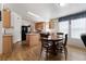 Eat-in kitchen with breakfast bar and natural wood cabinets at 6337 W Cactus Ave, Las Vegas, NV 89141