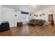 Cozy living room with wood laminate flooring and neutral wall paint at 6337 W Cactus Ave, Las Vegas, NV 89141