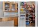 View of kitchen cabinets and walk-in pantry with shelving for ample storage at 6337 W Cactus Ave, Las Vegas, NV 89141