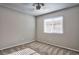 Bright bedroom featuring neutral walls, carpeted floors, a ceiling fan and a window providing natural light at 6848 Groveview Ln, Las Vegas, NV 89103