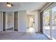 Bedroom with mirrored closet doors and bathroom access, leading to the backyard at 6848 Groveview Ln, Las Vegas, NV 89103