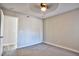 Bedroom featuring neutral walls, carpet flooring, a ceiling fan and access to another room at 6848 Groveview Ln, Las Vegas, NV 89103