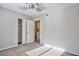 Bedroom with neutral walls, carpet flooring, closet, and access to the rest of the home at 6848 Groveview Ln, Las Vegas, NV 89103