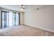 Carpeted bedroom with sliding glass doors leading to the backyard pool area at 6848 Groveview Ln, Las Vegas, NV 89103