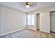 Cozy bedroom featuring neutral walls, carpeted floors, a window, and a closet at 6848 Groveview Ln, Las Vegas, NV 89103