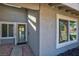 Inviting front entrance with an open door and sidelight allowing natural light at 6848 Groveview Ln, Las Vegas, NV 89103