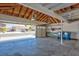 Spacious garage with high ceilings and an open garage door at 6848 Groveview Ln, Las Vegas, NV 89103