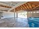 Spacious garage with high ceilings, open garage door, storage space, and water heater at 6848 Groveview Ln, Las Vegas, NV 89103