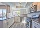 Modern kitchen featuring stainless steel appliances, a window, and subway tile backsplash at 6848 Groveview Ln, Las Vegas, NV 89103