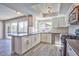 Modern kitchen featuring stainless steel appliances, gray countertops, and ample cabinet space at 6848 Groveview Ln, Las Vegas, NV 89103