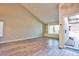 Spacious living room with built-in shelving, large windows, and stylish wood-like tile flooring at 6848 Groveview Ln, Las Vegas, NV 89103