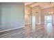 Spacious open-concept living room featuring high ceilings, hardwood flooring, and neutral paint at 6848 Groveview Ln, Las Vegas, NV 89103
