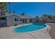 Inviting in-ground pool with concrete surround, perfect for relaxation and outdoor enjoyment at 6848 Groveview Ln, Las Vegas, NV 89103