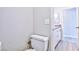 Close up of toilet in bathroom, bathroom vanity out of focus in background at 6848 Groveview Ln, Las Vegas, NV 89103