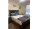 Bedroom with a dark wooden frame bed and neutral walls at 6955 N Durango Dr # 2016, Las Vegas, NV 89149