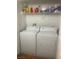 A well lit laundry room with a washer and dryer at 6955 N Durango Dr # 2016, Las Vegas, NV 89149