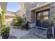 Stylish front entrance with double doors, stone accents, and decorative pond at 712 Proud Eagle Ln, Las Vegas, NV 89144