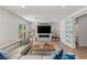 Modern living room showcasing a stone fireplace, tv, and cozy seating area at 712 Proud Eagle Ln, Las Vegas, NV 89144