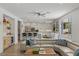 Bright living room featuring a modern kitchen, bar, and comfortable seating area at 712 Proud Eagle Ln, Las Vegas, NV 89144
