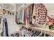 Walk-in closet provides ample storage with organized shelving, hanging rods, and shoe racks at 7201 Mission Hills Dr, Las Vegas, NV 89113
