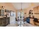 Stylish dining area with modern decor, a unique chandelier, and convenient built-in storage at 7201 Mission Hills Dr, Las Vegas, NV 89113