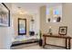 Inviting entryway featuring elegant marble floors, decorative console table, and a stylish stained glass front door at 7201 Mission Hills Dr, Las Vegas, NV 89113