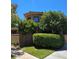 Well-maintained stucco home with manicured landscaping and privacy hedges around the property at 7201 Mission Hills Dr, Las Vegas, NV 89113